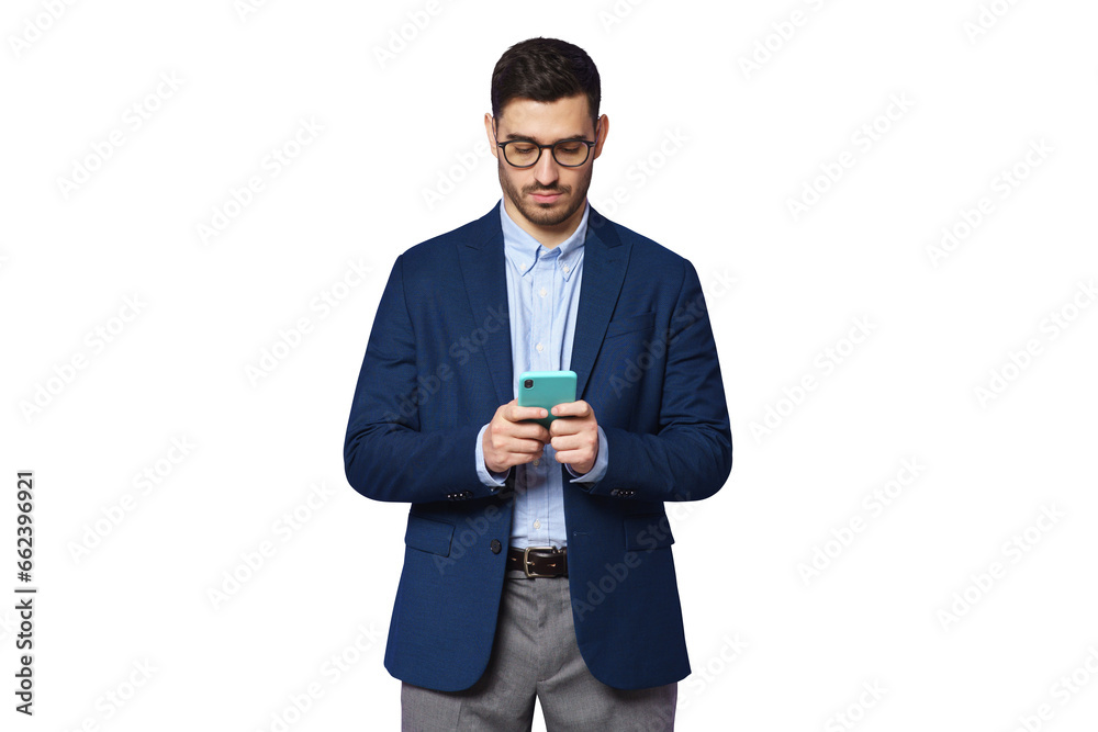 Serious young businessman wearing blue suit, looking at phone screen, chatting online, surfing the internet Serious young businessman wearing blue suit, looking at phone screen, chatting online, surfing the internet