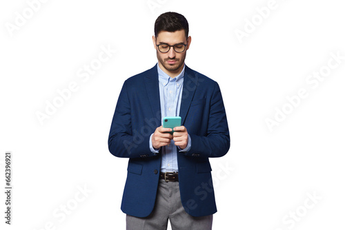 Serious young businessman wearing blue suit, looking at phone screen, chatting online, surfing the internet