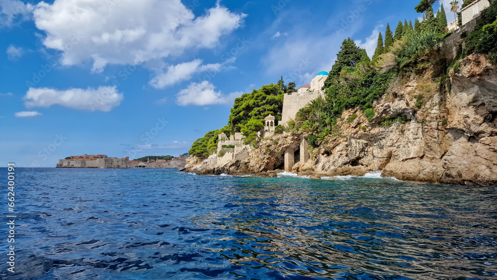 Beautiful view of the rocky coast in Croatia, with the city of Dubrovnik in the background, summer 2023 Beautiful view of the rocky coast in Croatia, with the city of Dubrovnik in the background, summer 2023
