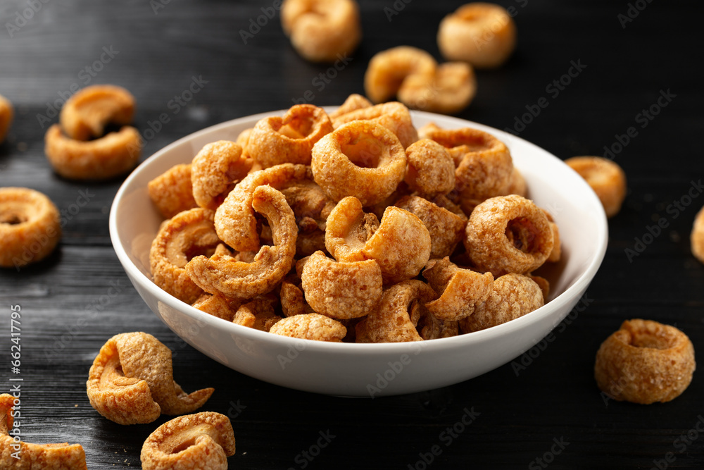 Crispy Pork crackling, scratchings. deep fries in white bowl Crispy Pork crackling, scratchings. deep fries in white bowl