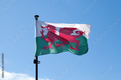 Flag of Wales waving atop of its pole