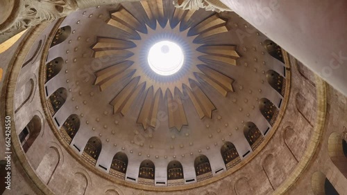 Low angle on the Dome of the Anastasis located above the aedicule in Jerusalem. Holy and famous Christian site located in the Church of the Holy Sepulchre in the old city of Jerusalem, Israel photo