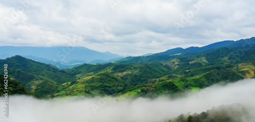 Panorama of high mountain ranges Filled with green trees nature and complex mountain ranges