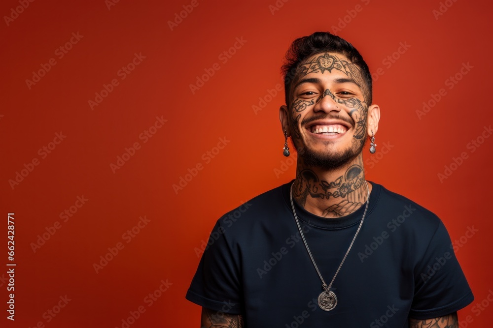 Young man with neck and face tattoos smile happy face Young man with neck and face tattoos smile happy face