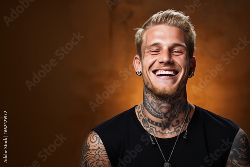 Young man with face and neck tattoos smile happy face photo
