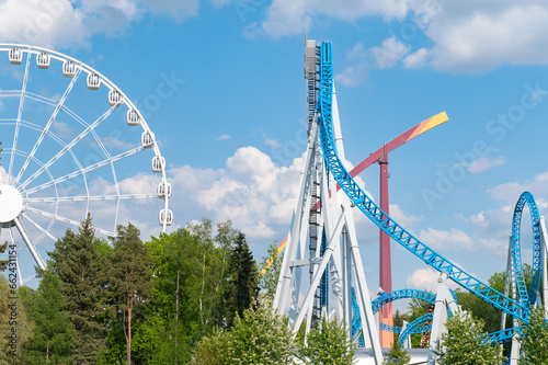 Divo Island Amusement Park in Saint Petersburg. there are numerous attractions for entertainment against the background of the blue summer sky