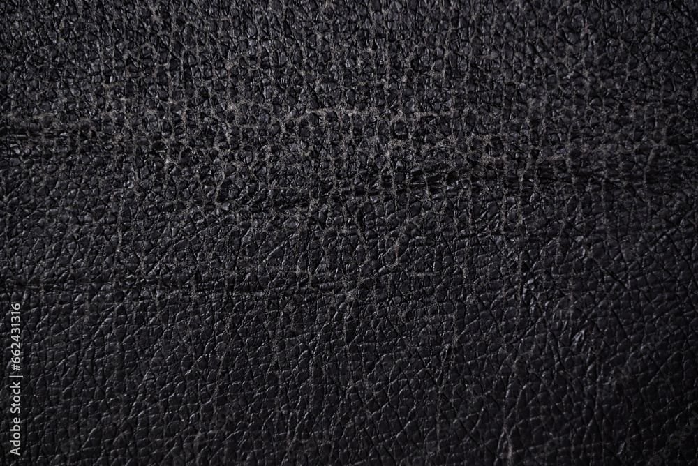 close up of worn out leatherette or imitation leather with its surface already cracking and showcasing the textile-like materials used close up of worn out leatherette or imitation leather with its surface already cracking and showcasing the textile-like materials used