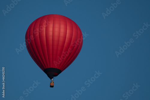 Red hot air balloon in the sky