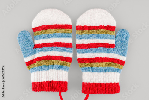 Wool fabric mittens for cold winter weather, warm hands in children, children's clothing, isolated on a white background