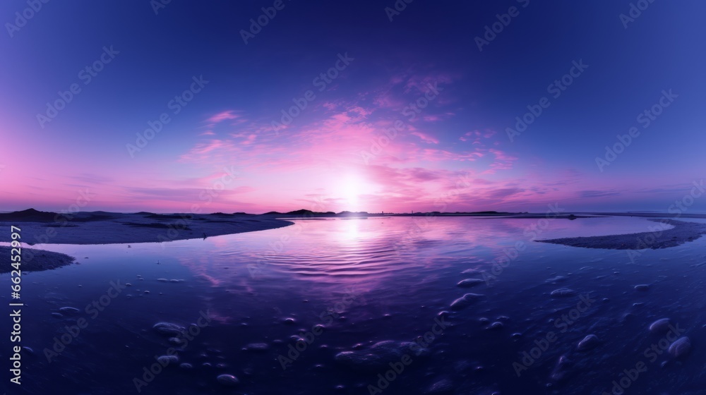 Fototapeta premium The sun is setting over a body of water