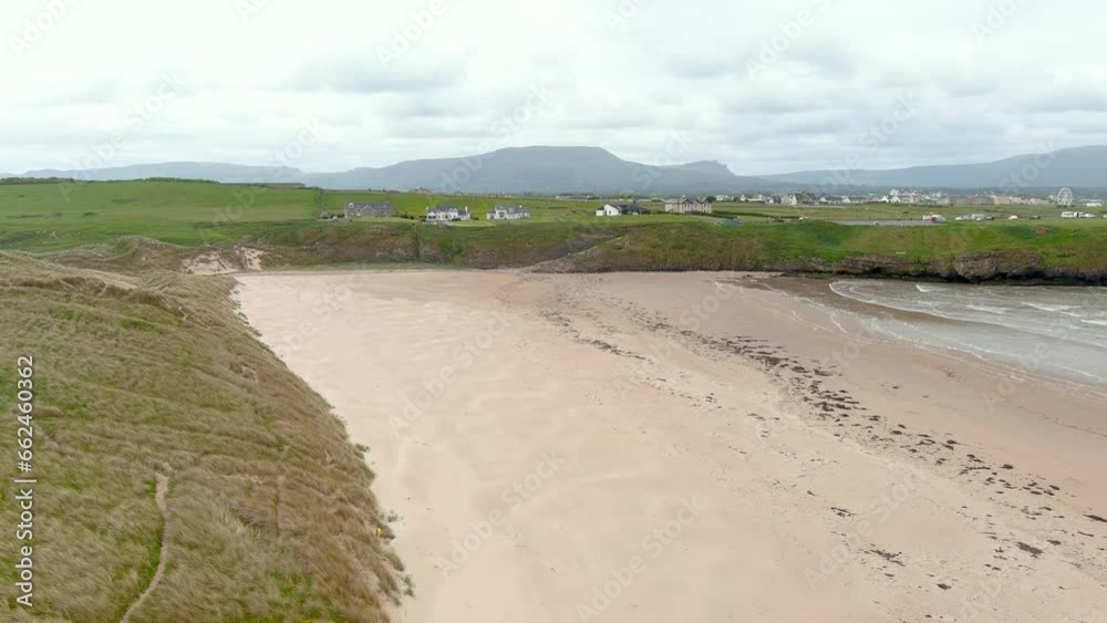Aerial view of spectacular Tullan Strand, one of Donegal's famous surf beaches, framed by a scenic back drop provided by the Sligo-Leitrim Mountains. Wide flat sandy beach in Co. Donegal, Ireland. Aerial view of spectacular Tullan Strand, one of Donegal's famous surf beaches, framed by a scenic back drop provided by the Sligo-Leitrim Mountains. Wide flat sandy beach in Co. Donegal, Ireland.