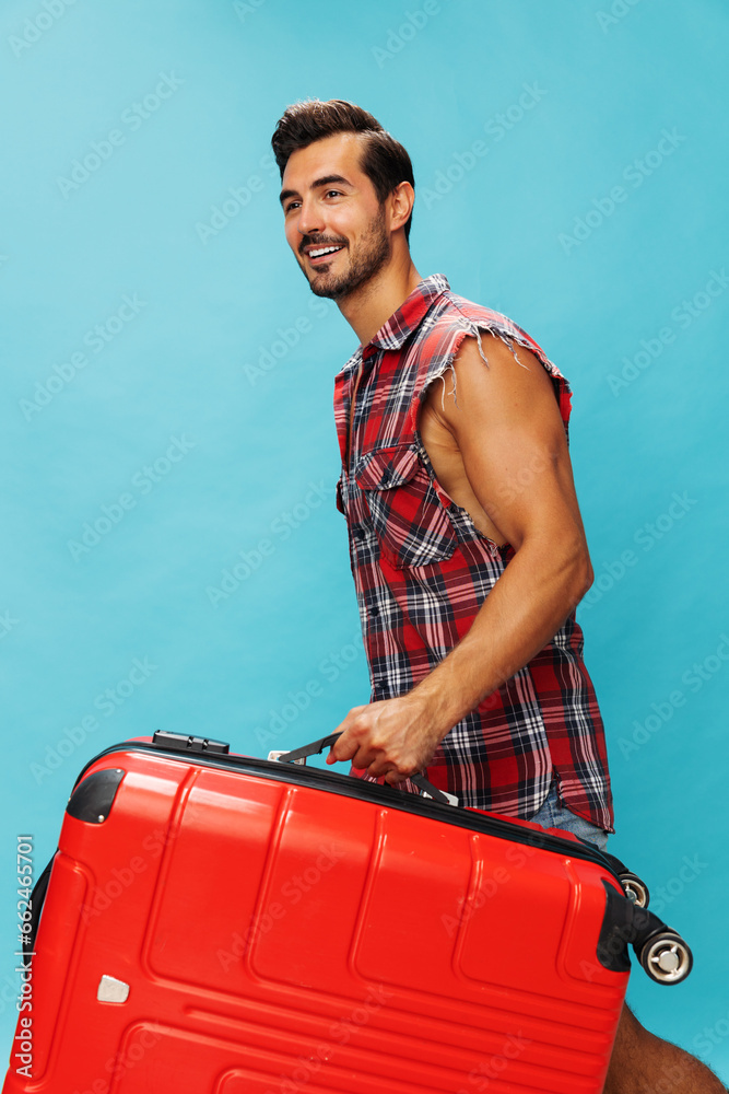 Happy man trip flight suitcase journey vacation baggage travel background traveler studio