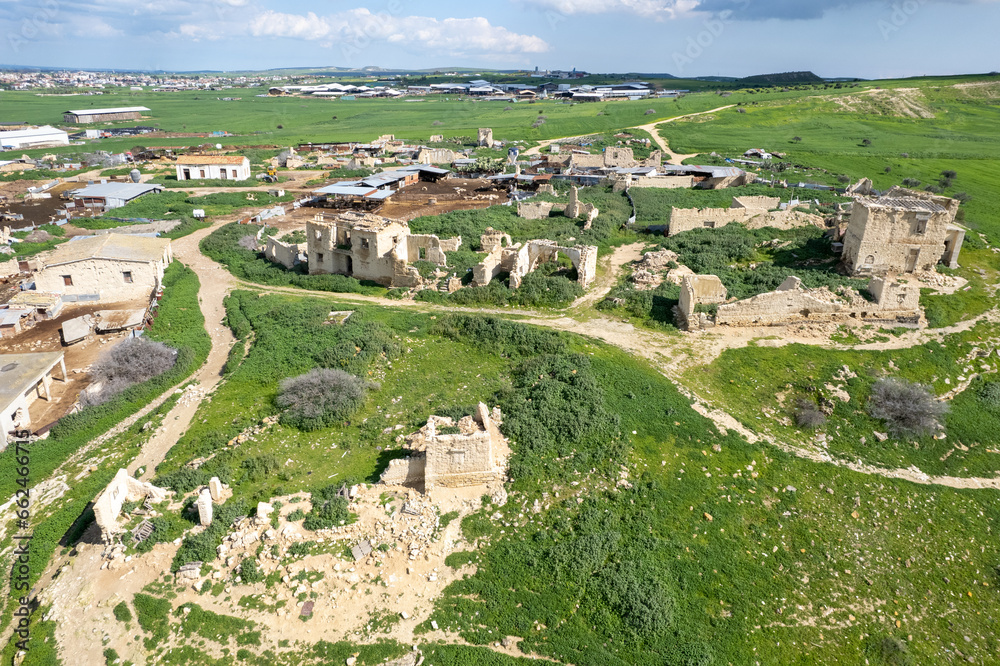 Drone aerial view of an abandoned deserted village. Ruins of deserted old town. Petrofani, Athiainou Cyprus
