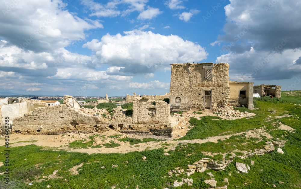 Drone aerial view of an abandoned deserted village. Ruins of deserted old town. Petrofani, Athiainou Cyprus