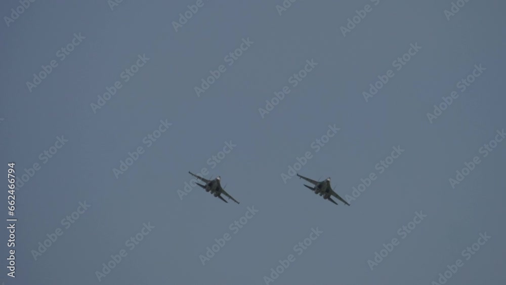 Two military fighter planes in the sky. Jets at an airshow. Military aviation concept Two military fighter planes in the sky. Jets at an airshow. Military aviation concept
