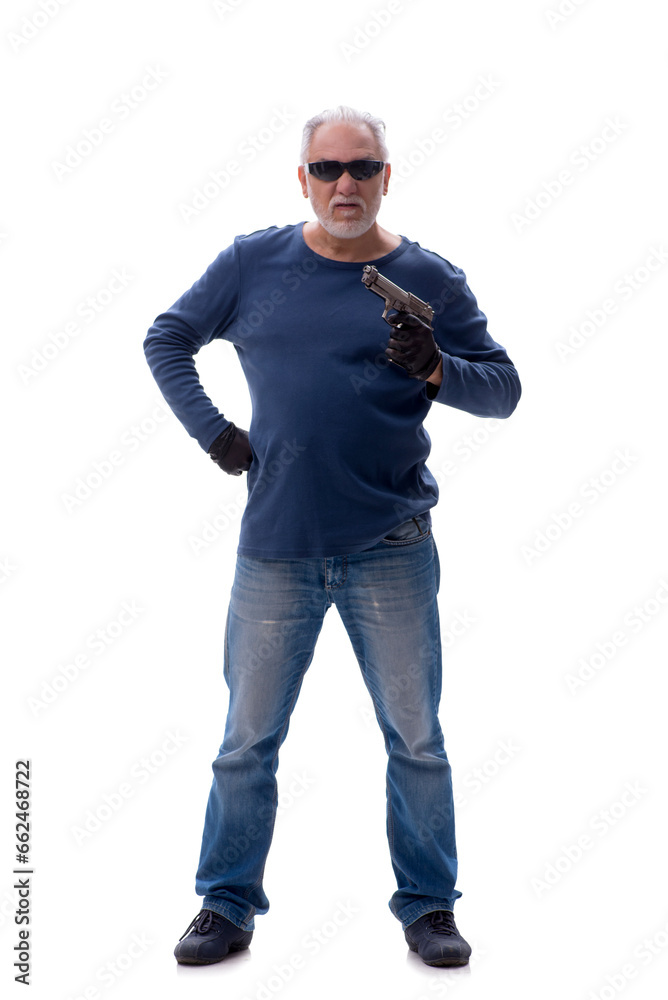 Fototapeta premium Old male burglar holding handgun isolated on white