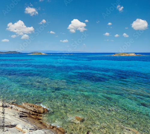 Fototapeta Naklejka Na Ścianę i Meble -  Aegean sea coast landscape with rocky island, view near Karidi beach (Chalkidiki, Greece).
