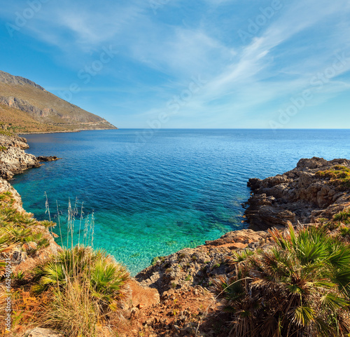 Obraz na płótnie Paradise sea bay with azure water and beach view from coastline trail of Zingaro Nature Reserve Park, between San Vito lo Capo and Scopello, Trapani province, Sicily, Italy. Two shots stitch image. w salonie