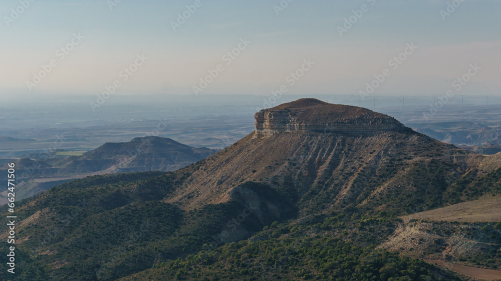 View of the Bardena Negra or Bardena black desert landscape of Bardenas Reales with vegetation, Navarra, Spain