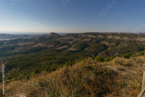 View of the Bardena Negra or Bardena black desert landscape of Bardenas Reales with vegetation, Navarra, Spain