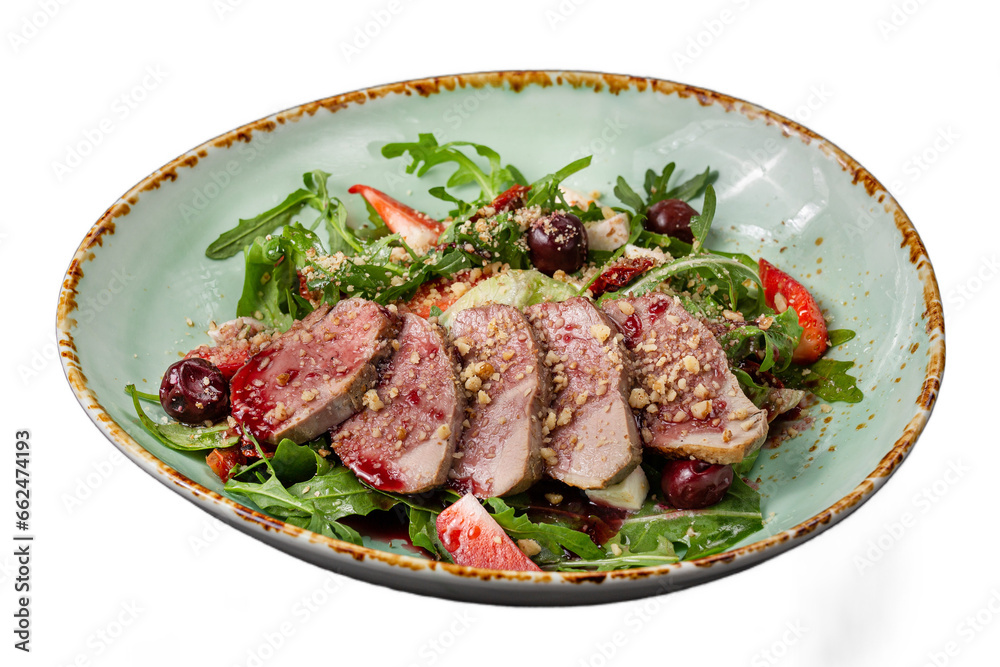 Arugula salad with duck breast and strawberries, mozzarello cheese. Isolated dish for menu. Arugula salad with duck breast and strawberries, mozzarello cheese. Isolated dish for menu.