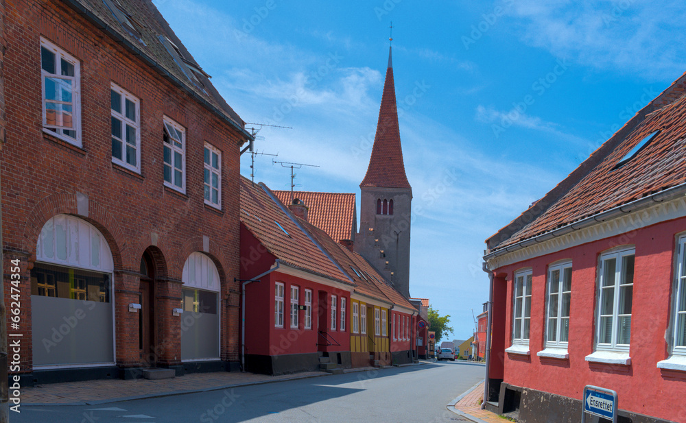 Obraz premium a traditional small,red,danish framehouse in summer in Bornholm with blue sky