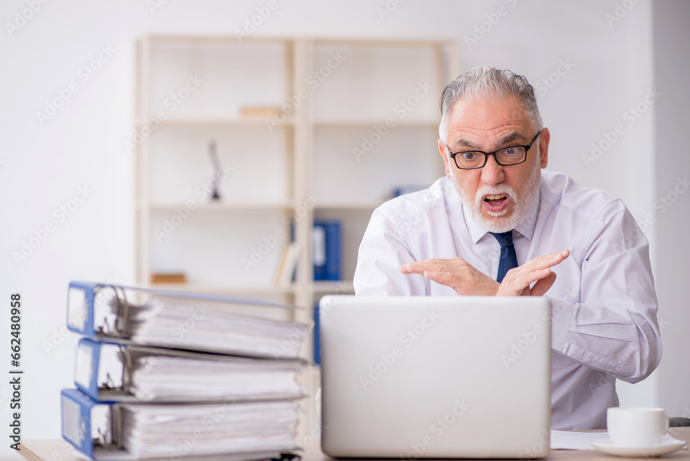 Old male employee and too much work in the office