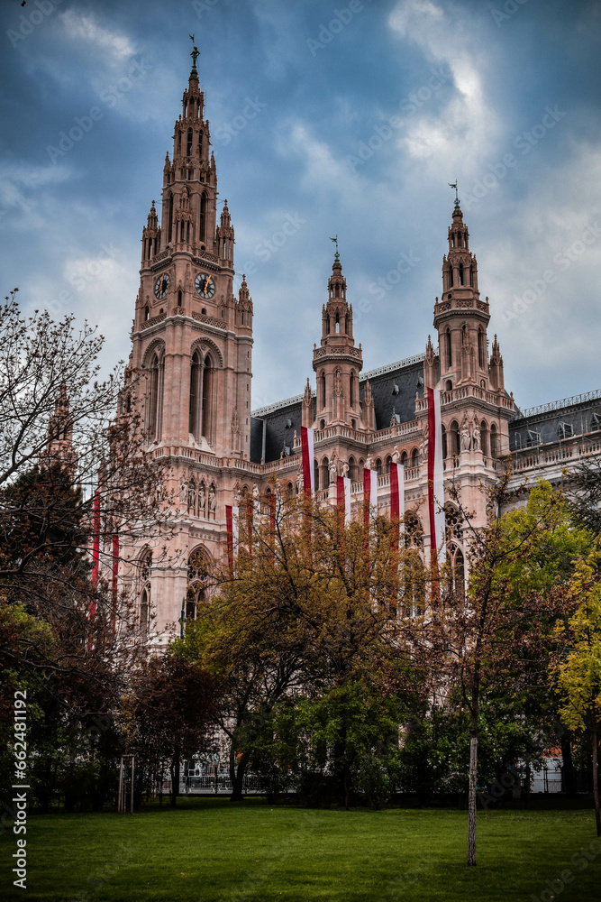 Wien city hall with long flags and autumn trees