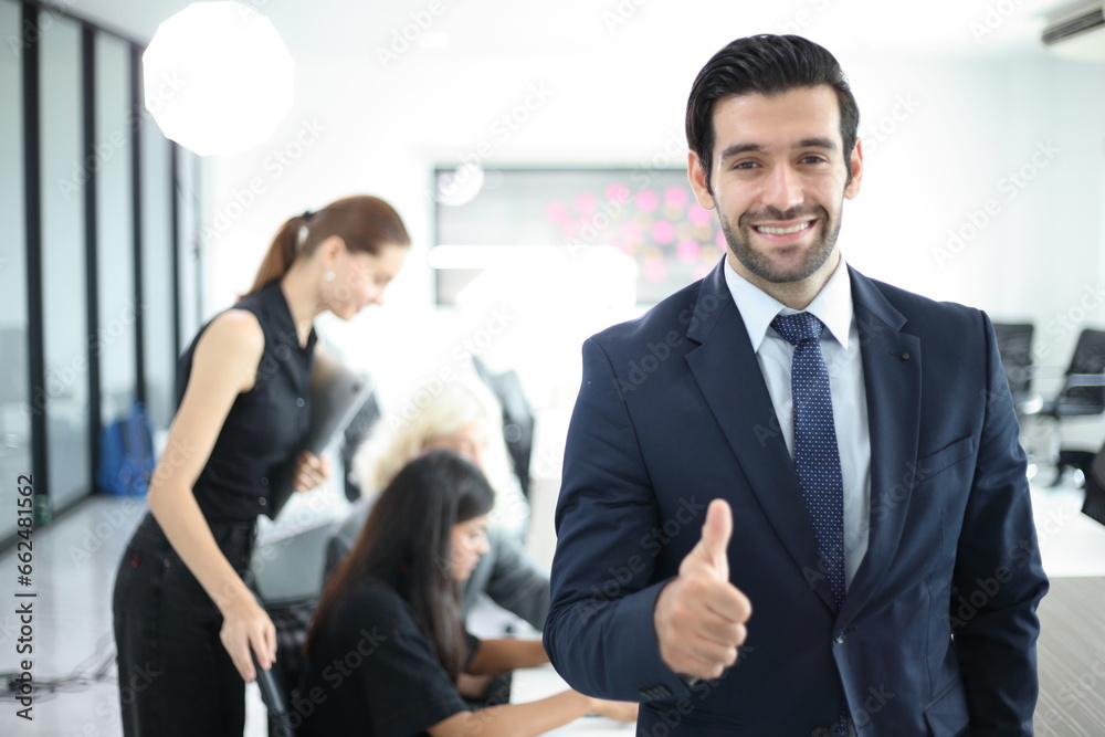 Business People, Successful business professionals. Diverse team celebrating business success at meeting. Business People, Successful business professionals. Diverse team celebrating business success at meeting.