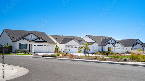 White Single family homes on a clear sunny day