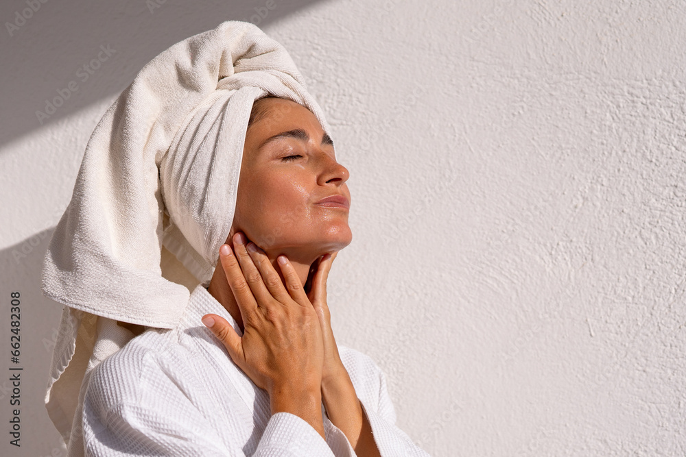 with the procedure of applying a moisturizing cream on a woman's face with the procedure of applying a moisturizing cream on a woman's face