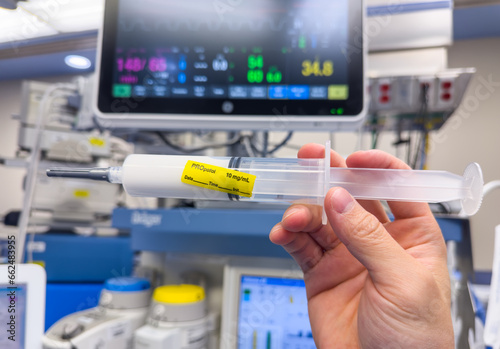 medications and syringes, symbolizing healthcare, treatment, and pharmaceuticals in a clinical setting including fentanyl hydromorphone propofol midazolam succinylcholine vaccine rocuronium  photo