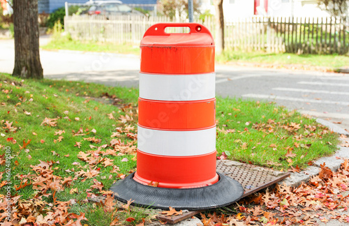 construction cone on urban road, representing safety, work in progress, and traffic control in a dynamic city environment