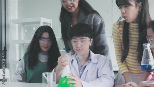 group of students having fun science experiments in the classroom