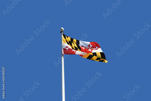 Maryland state flag flying in the daytime