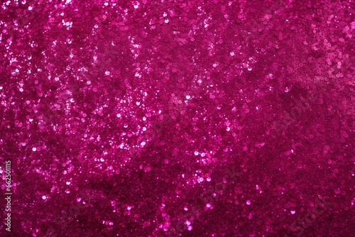 Sparkles on a magenta fuchsia background perfect for a backdrop photo
