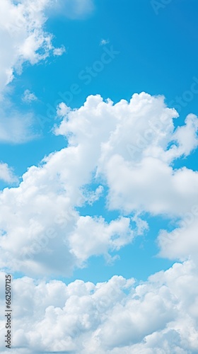 Background of blue sky with snow-white clouds. vertical background