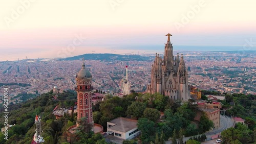 Aerial view of Barcelona skyline with the Expiatory Church of the Sacred Heart of Jesus at sunrise. Tibidabo mountain. Catalonia, Spain photo