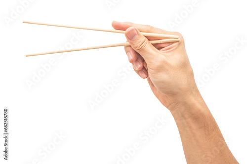isolated of a man s hand holding a wood chopstick.