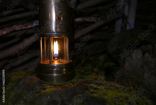 Camping at Lake Kawaguchi, Mt. Fuji in Japan. Beautiful warm light oil lamps, gasoline lanterns and logs. photo