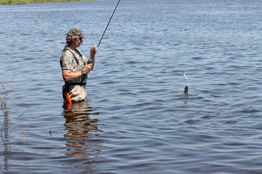 Fishing. One of a series of photos of fishermen catching northern pike. Fishing. One of a series of photos of fishermen catching northern pike.