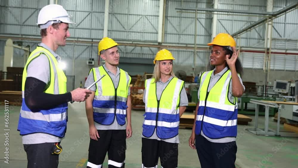 Supervisors check names male and female workers standing in line before coming work by checking safe dress code before entering work in factories warehouses packaging industry logistics cardboard.