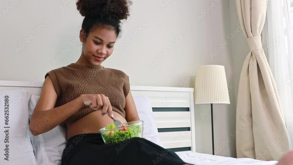 Young mother Thai-African descent eats healthy salad with vitamins and minerals. Vegetables that are beneficial to the body pregnant women and add nutrition to boost the health immunity of the fetus.
Young mother Thai-African descent eats healthy salad with vitamins and minerals. Vegetables that are beneficial to the body pregnant women and add nutrition to boost the health immunity of the fetus.