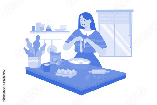 The girl is baking in the kitchen