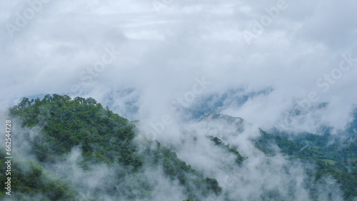 Doi Luang Chiang Dao mountain hills in Chiang Mai, Thailand. Nature landscape in travel trips and vacations. Doi Lhung Chiang Dao Viewpoint with clouds mist and fog during rain season