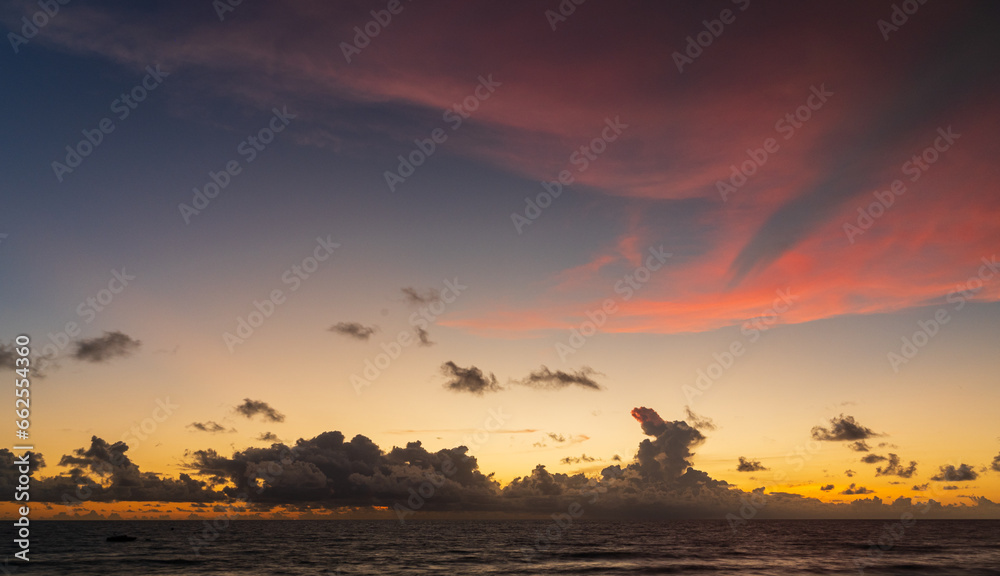 Abstract amazing Scene of stuning Colorful sunset or sunrise with clouds background in nature and travel concept, wide angle shot Panorama shot,Copy space