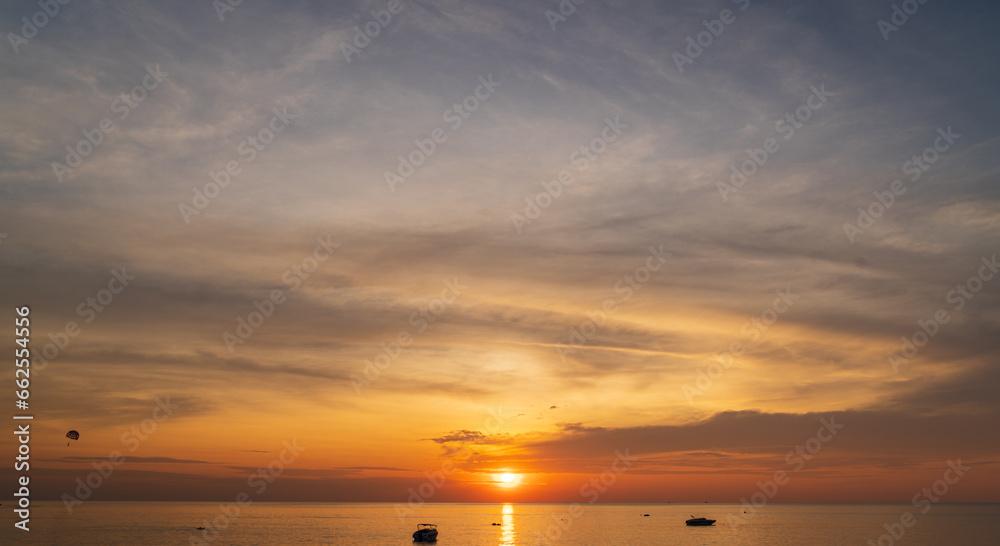 Obraz premium Abstract amazing Scene of stuning Colorful sunset or sunrise with clouds background in nature and travel concept, wide angle shot Panorama shot,Copy space