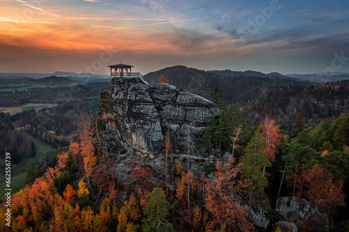 Jetrichovice, Czech Republic - Aerial view of Mariina Vyhlidka (Mary's view) lookout with a beautiful Czech autumn landscape and colorful golden sunset sky in Bohemian Switzerland region photo