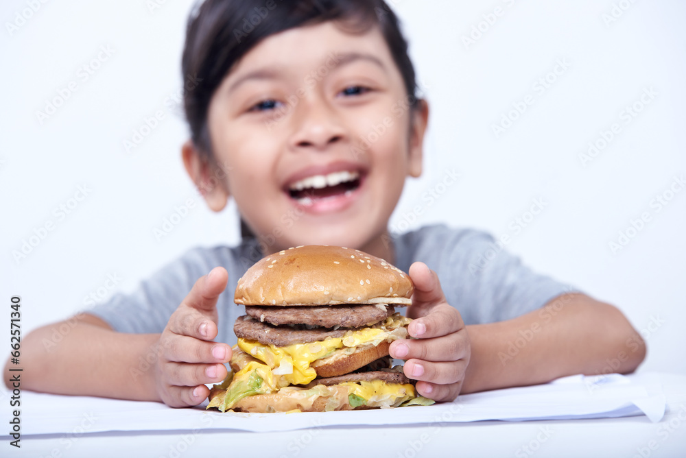 Asian Little Girl holding hamburger on a white backgroun