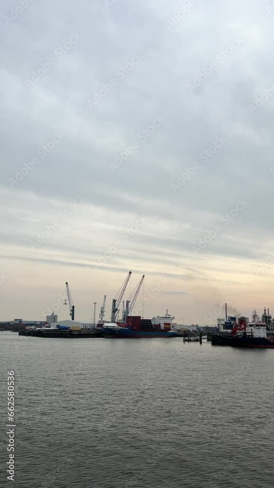 Port of Hamburg on the river Elbe in Germany in the early morning. It is the third largest in Europe Port of Hamburg on the river Elbe in Germany in the early morning. It is the third largest in Europe